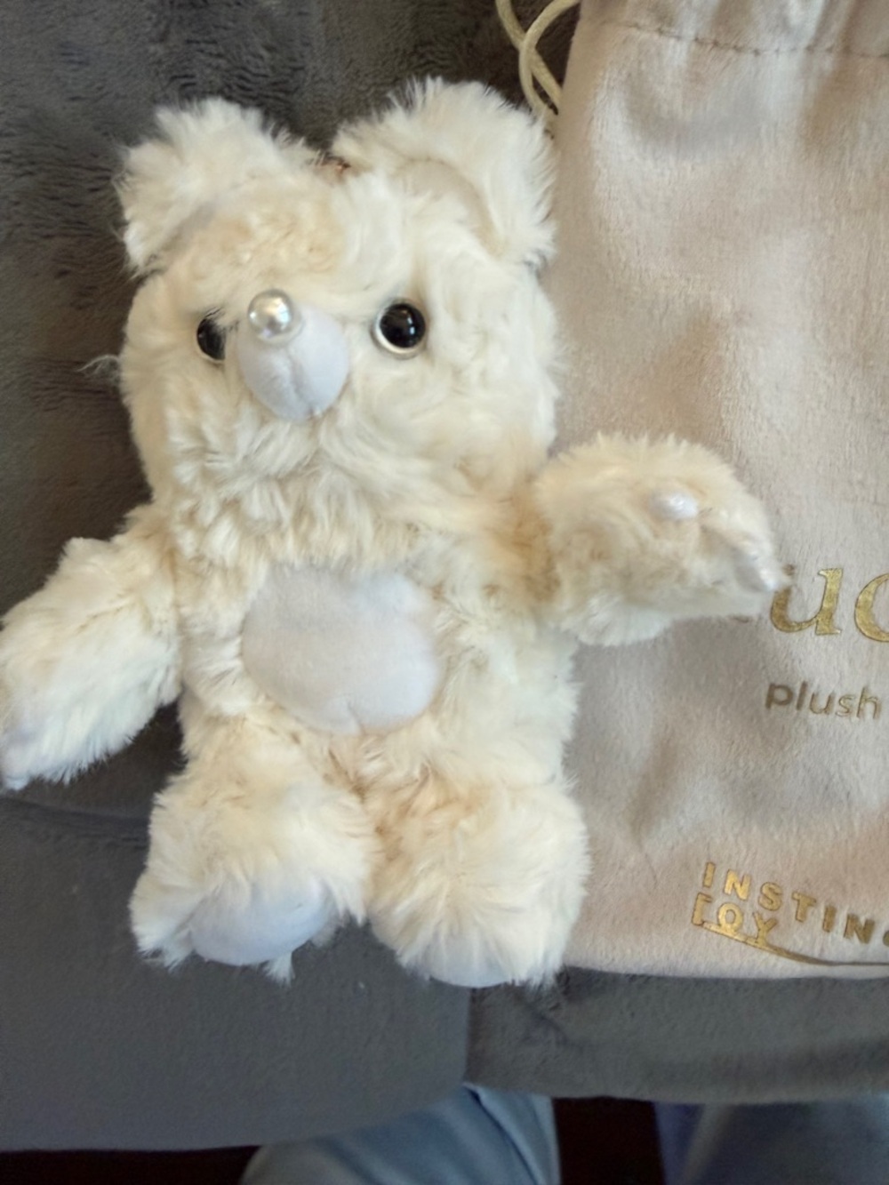 Muckey Plush with velvet Bag cute white plush and trademark eyes 👀 on behind.